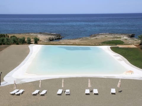 Water, Sky, Property, Azure, Outdoor Furniture, Swimming Pool, Beach, Body Of Water, Shade, Coastal And Oceanic Landforms