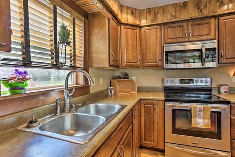 Double basin sink with a large window for natural light.