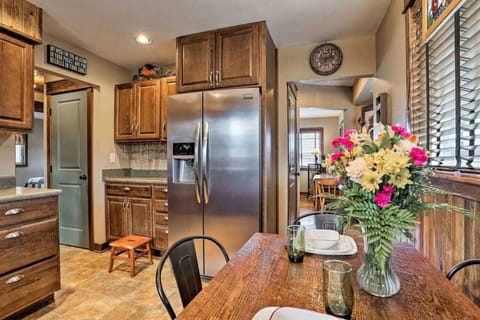 Full-size refrigerator, a cozy coffee bar, and a dining table for 4 people.