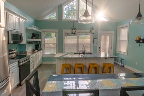 Natural light surrounds you in the kitchen and dining areas.