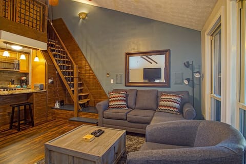 Living room and stairs to loft