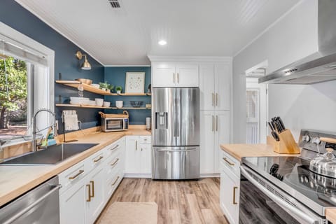 Our meticulously renovated kitchen is fully equipped with high-end appliances.