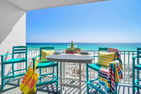 Savor your morning coffee or evening wine on your private balcony, where turquoise waters and pristine beaches create the perfect backdrop for relaxation.
