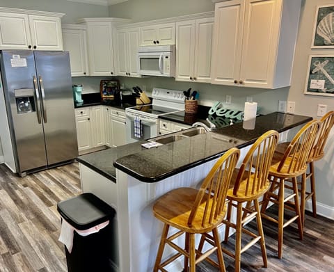 Seating for four at the kitchen bar.