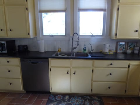 Country kitchen with modern appliances.