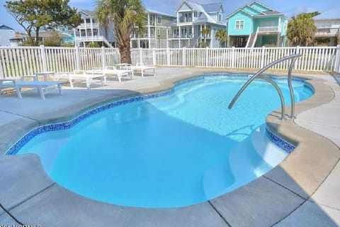 Private pool with fencing and gates. Plenty of outdoor seating and dining