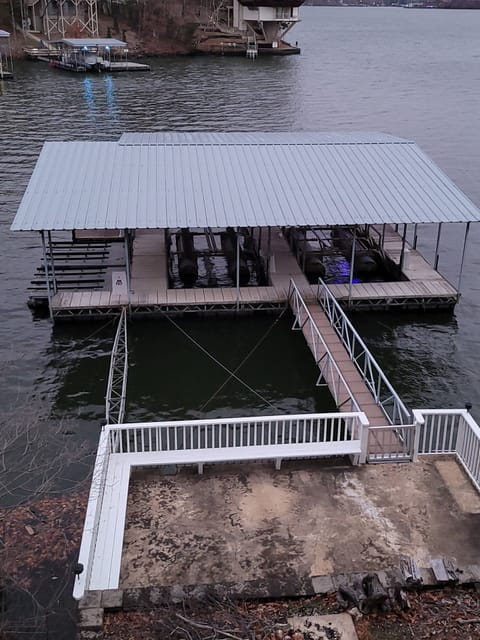 Large private dock for guests with dual boat lifts and quad jetski lifts for use