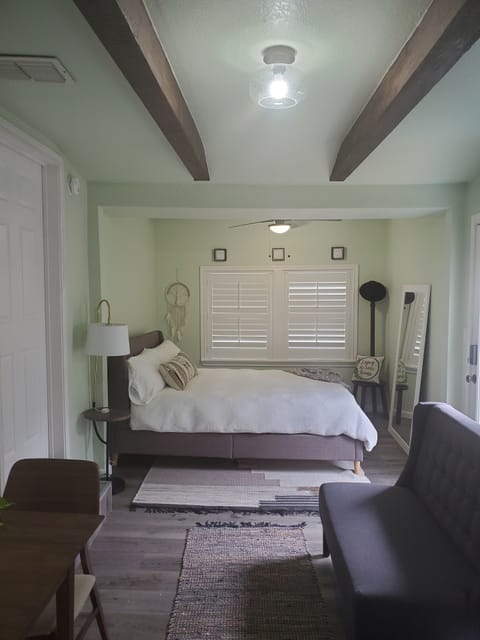 Queen size bed,  small loveseat, beautiful beams, new window shutters