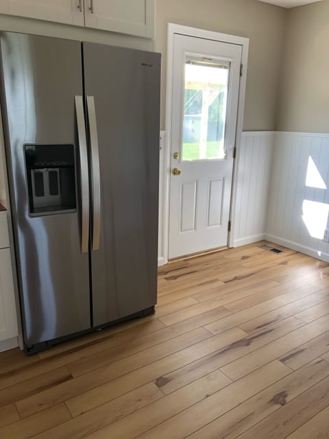 Kitchen with brand new refrigerator 