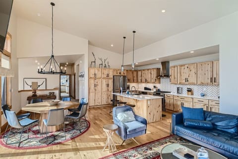 Open concept kitchen, dining and living area