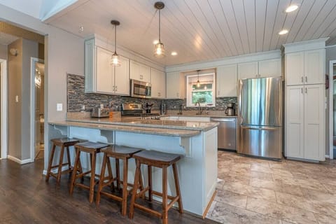 Fully Stocked Kitchen with Breakfast Bar