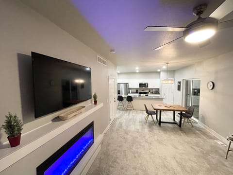 Living area w/ Dining Table that seats 6 with 2 additional seats at bar counter