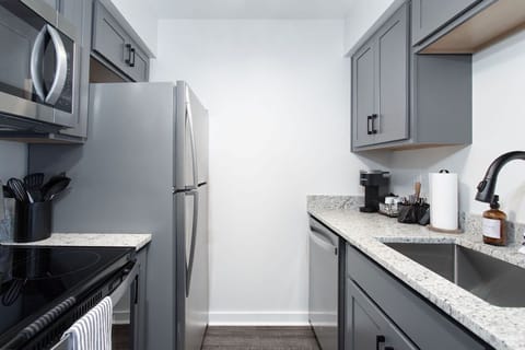 Full sized fridge, oven, stove, microwave and dishwasher