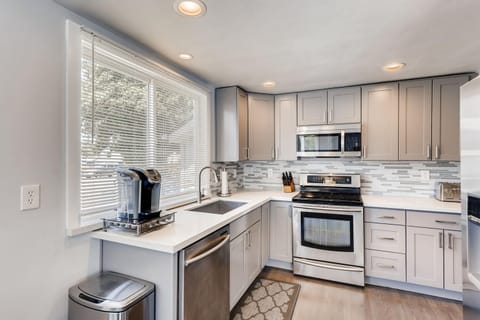 Another view of the kitchen with newer induction range