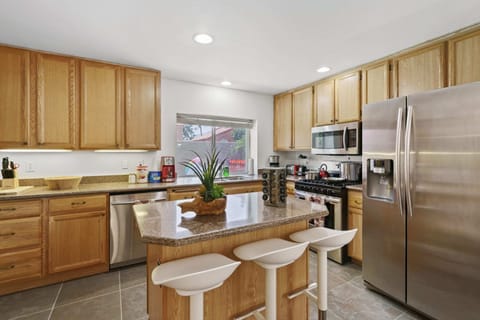 Enjoy the kitchen with coffee, creamers, mixers, refrigerator, oven, stove, pots, pans, cooking supplies, cutlery, cups, plates, bowls, utensils, small appliances, and many essentials!