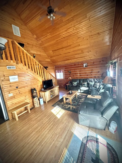 Living room with stairs going to loft