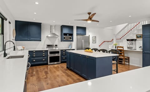 Pass-through from DR to kitchen. Stairs to second floor & giant popcorn machine.