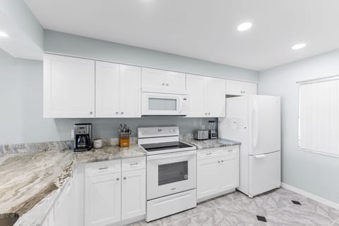 Modern kitchen with ample cabinet storage and everything you need to cook your favorite meals.
