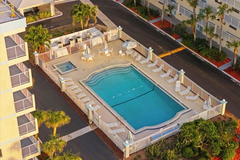 Lounge by the large heated pool surrounded by plenty of seating for sunny days and peaceful evenings