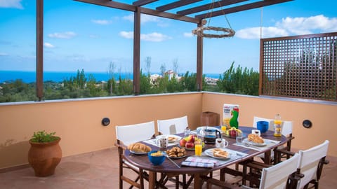 Spacious balcony with sitting area and sea view