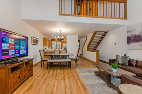 Inviting Open Concept Floor Plan With Leather Couches, Smart Roku TV & Window Kitchen