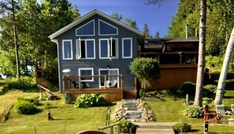 Armour stone steps leading to dock, fire pit and private master bedroom deck 