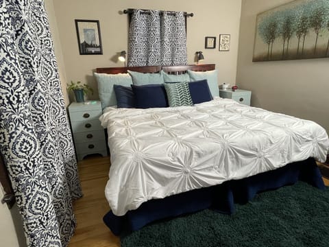 Master bedroom with split king pillowtop, HD smart TV, closet with hangars.