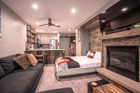 Fireplace, Indoors, Couch, Furniture, Ceiling Fan