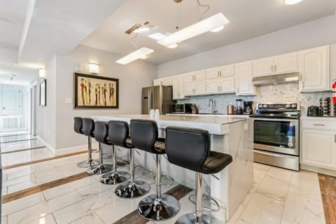 Kitchen area with bar stools