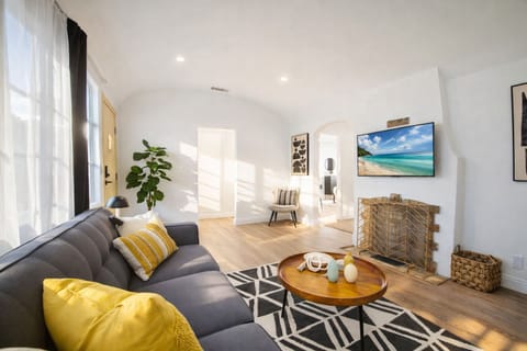 Spacious living area with natural light, cozy seating, and a modern design—ideal for families and longer stays.