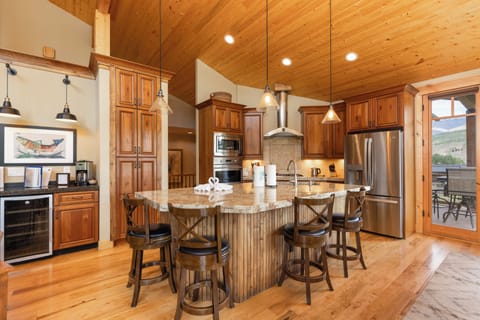 Main level full kitchen and bar area.