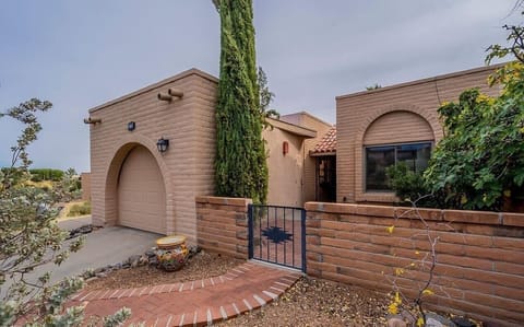 Front of house including one car garage on the left
