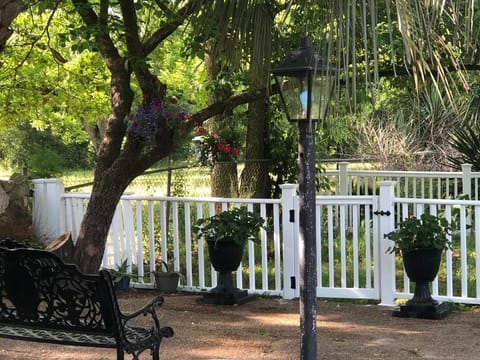 Shaded Benches for sitting near the waterfall and gated area for your pet