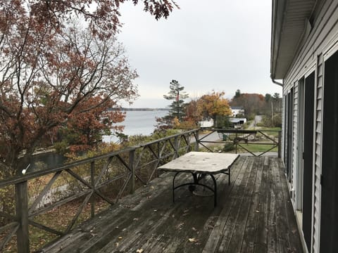 View looking upriver with Peel Dock Rd. between the river and house.