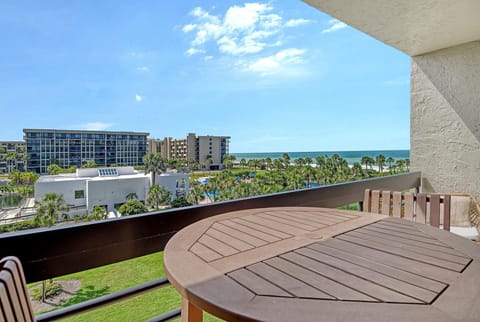 Gulf-view balcony with cozy seating and fresh sea breeze