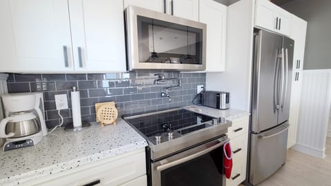 Nicely equipped kitchen with granite counter tops