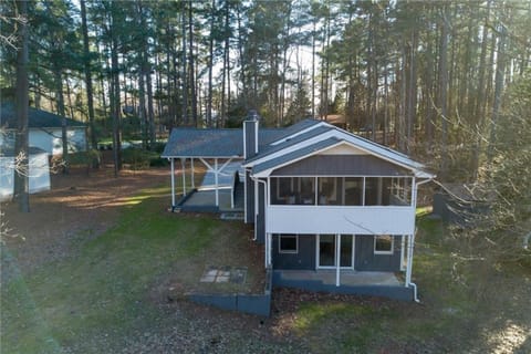 Carport, screened in porch, and covered patio