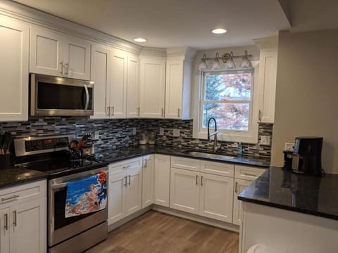 Large kitchen with lots of cooking equipment