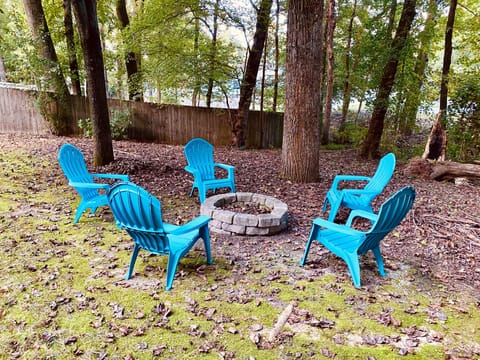 Enjoy outdoor fire pit in the wooded backyard.