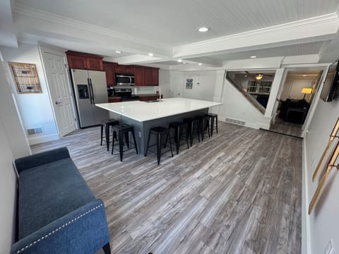 Entryway opens up to the kitchen and dining area.