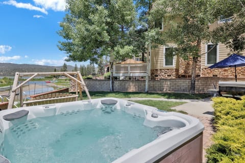 Private outdoor hot tub, surrounded by tall pines, perfect for relaxing under the trees after a day of adventure—enjoy peaceful forest views, fresh air, and a truly rejuvenating stay.