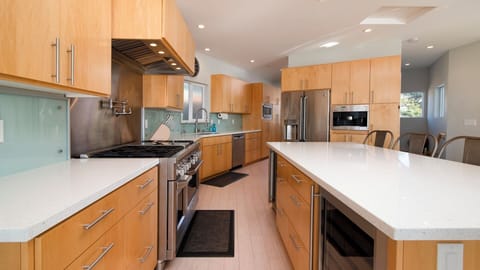 The kitchen has high-end appliances and lots of storage