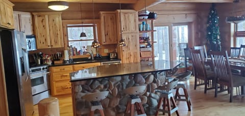 Open-concept kitchen and dining areas.