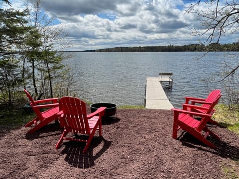 Private dock and shoreline with fire pit