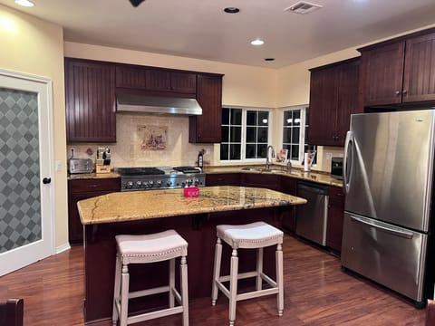 2nd Floor: HUGE Kitchen with full-size fridge & 6 burner stove with a griddle