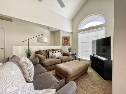 Living room with vaulted ceilings & Amazon Fire Smart TV
