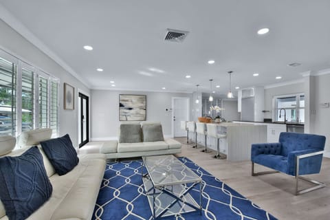 Open plan interior with lots of natural light, modern and comfortable furnishings throughout