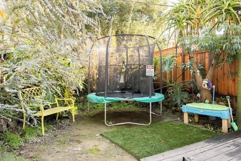 Family-friendly backyard with trampoline and seating — kids can play while adults relax. Perfect for couples seeking charm, families making memories, or business travelers needing fresh air breaks.