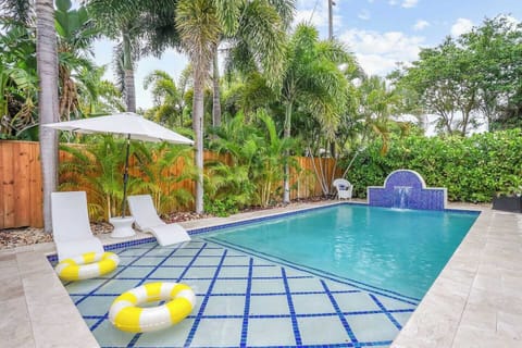 Brand new saltwater pool reno with sun shelf and water feature. All marble decking throughout entire backyard for complete outdoor living. Poolside covered dining and seating
