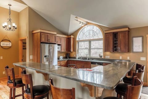 Wrap around bar with seating in the heart of the home.